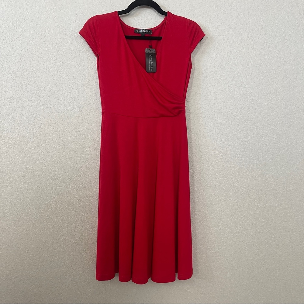 Women’s true red dress size small new with tags. V-neck